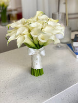 Wedding bouquet of white calla lilies