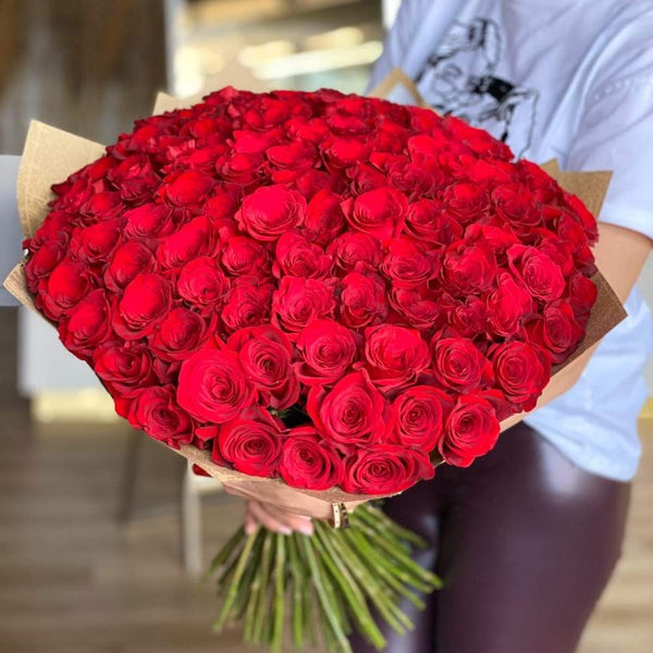 bouquet of red and white roses wrapped in brown paper 22889790